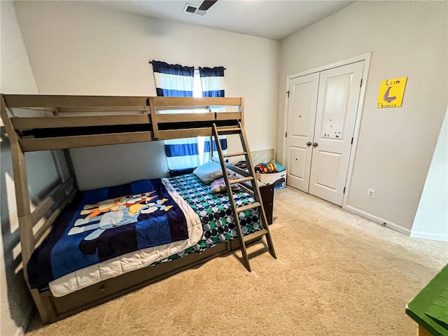 carpeted bedroom featuring a closet