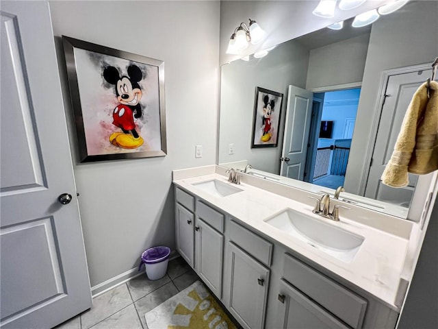 bathroom with tile patterned floors and vanity