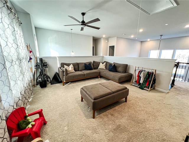 living room featuring carpet flooring and ceiling fan