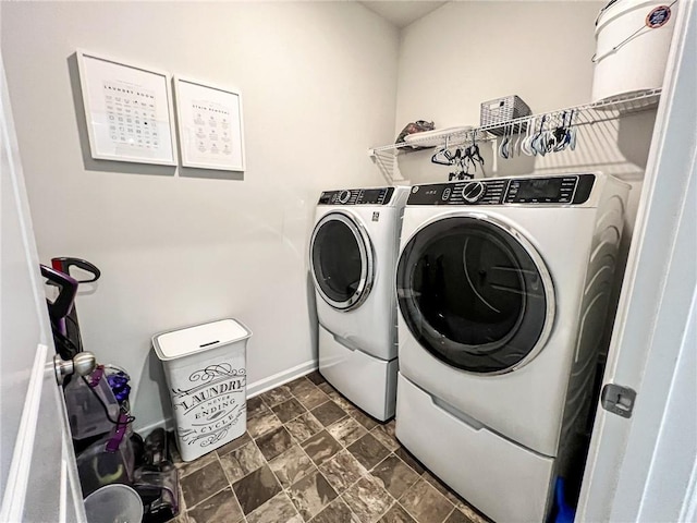 clothes washing area with washing machine and dryer