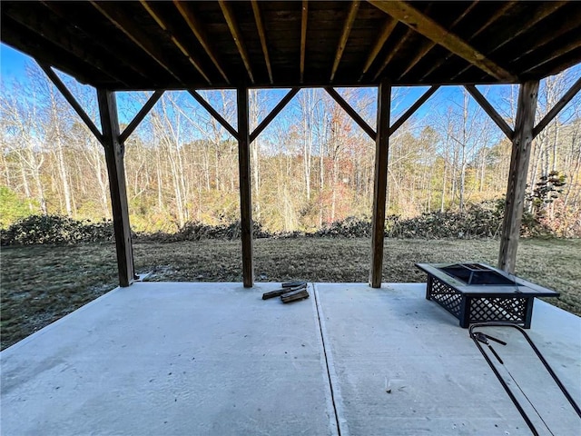 view of patio / terrace with an outdoor fire pit