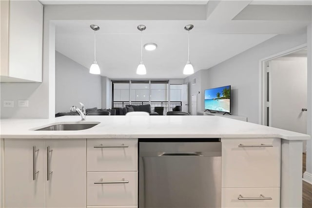 kitchen featuring stainless steel dishwasher, open floor plan, white cabinetry, a sink, and light stone countertops