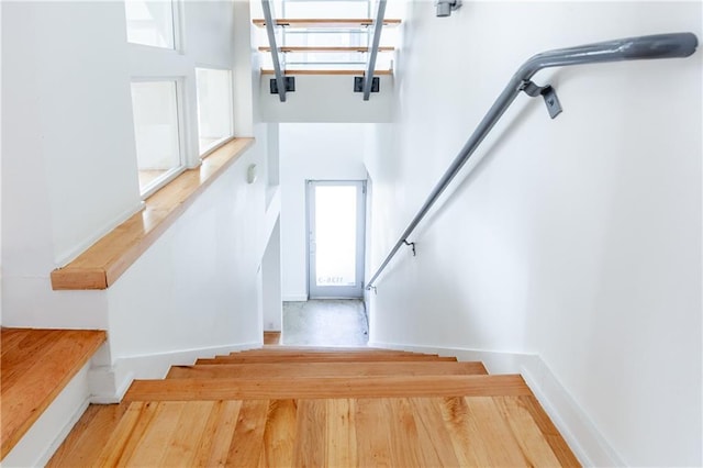 stairway with wood-type flooring