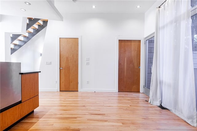 empty room with light wood-type flooring