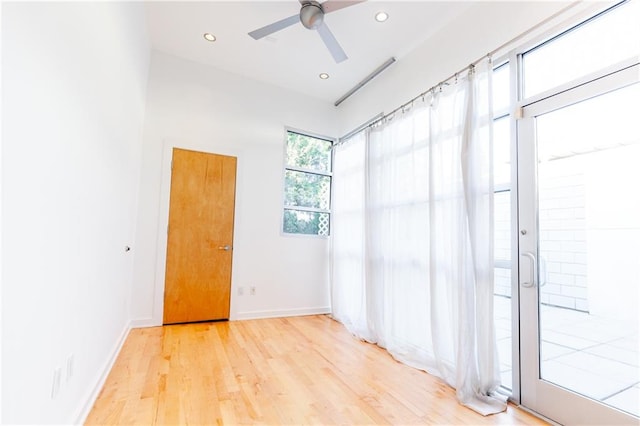 unfurnished room featuring light hardwood / wood-style flooring and ceiling fan