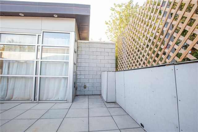 exterior details featuring tile patterned floors