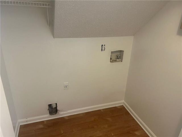 washroom featuring washer hookup, laundry area, baseboards, electric dryer hookup, and wood finished floors
