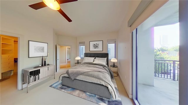 bedroom featuring access to exterior and ceiling fan