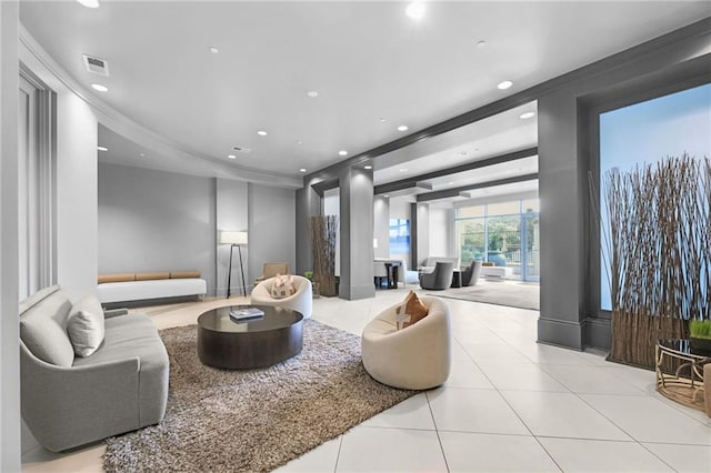 tiled living room featuring crown molding