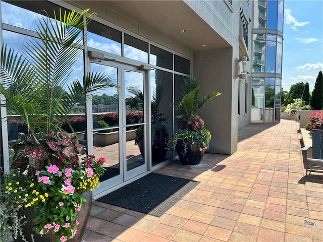 entrance to property featuring a patio