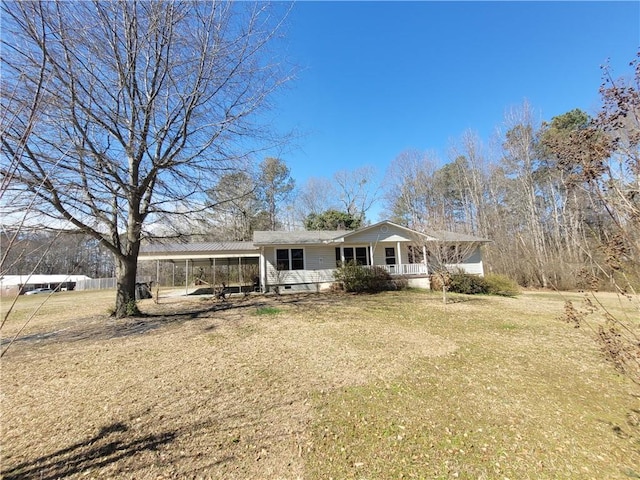 view of front of home with a carport, a porch, crawl space, and a front yard