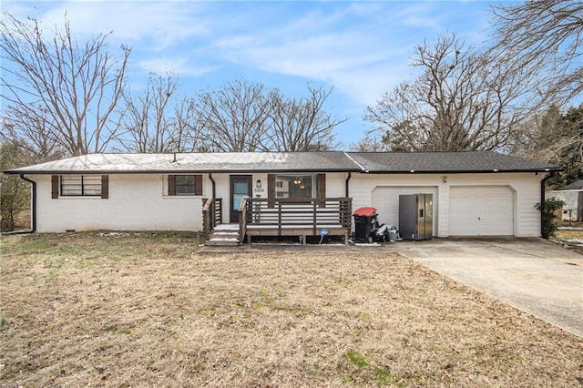 ranch-style home with a garage and a front lawn