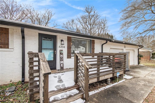 view of exterior entry with a garage