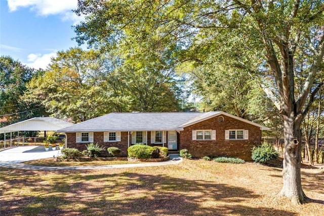 ranch-style home featuring a carport