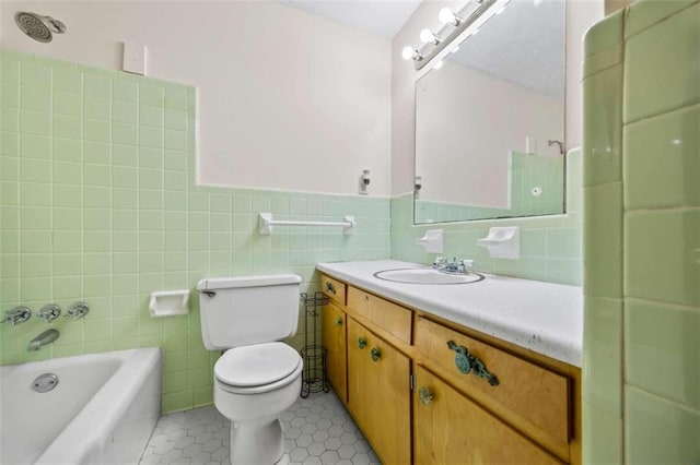 full bathroom featuring toilet, tile walls, shower / tub combination, vanity, and tile patterned flooring