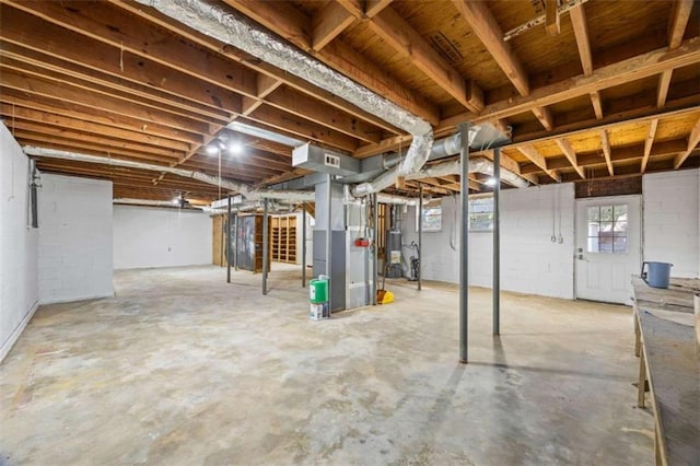 basement with heating unit and gas water heater