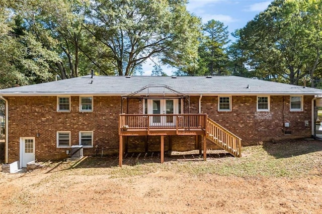 rear view of house with a wooden deck