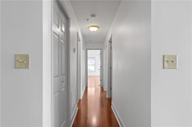 hall with dark hardwood / wood-style floors