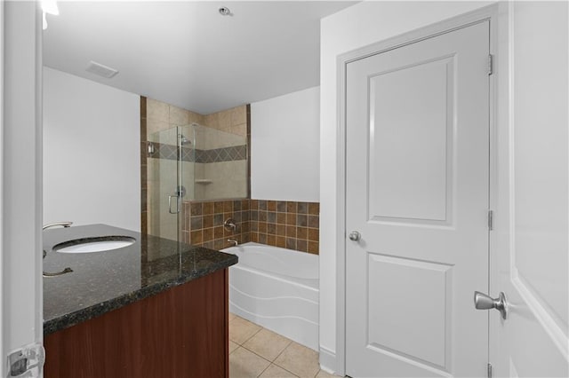 bathroom featuring tile patterned flooring, vanity, and independent shower and bath