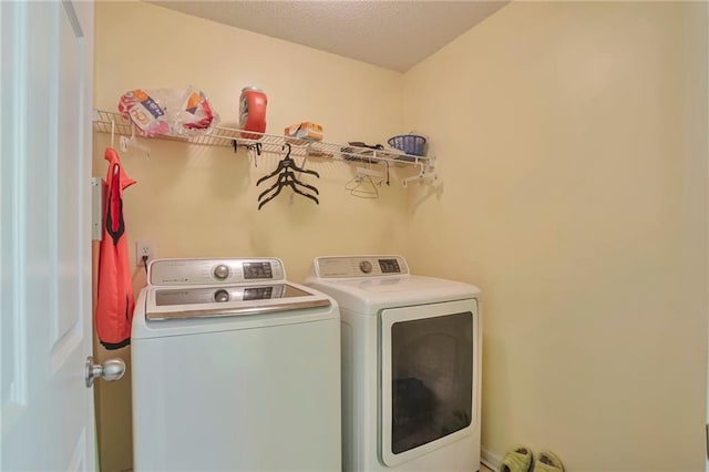 laundry room featuring washer and clothes dryer