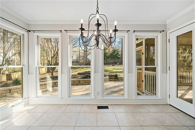 unfurnished sunroom with visible vents and a chandelier