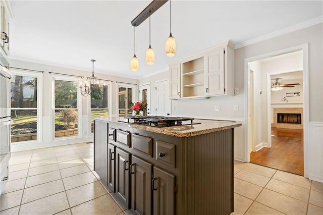 kitchen with light tile patterned floors, ornamental molding, a center island, black cooktop, and open shelves