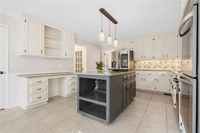 kitchen with stainless steel fridge, built in desk, fridge, and open shelves