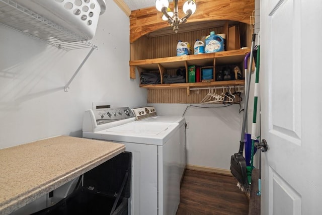 laundry room with laundry area, dark wood-type flooring, and washer and clothes dryer