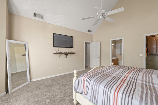 carpeted bedroom featuring ensuite bathroom, high vaulted ceiling, visible vents, and baseboards