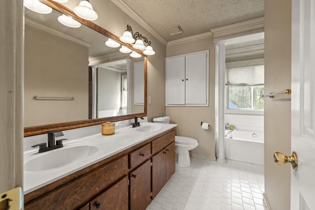 bathroom with a textured ceiling, ornamental molding, a sink, and a garden tub