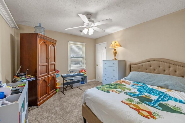 bedroom featuring a textured ceiling, baseboards, a ceiling fan, and light colored carpet