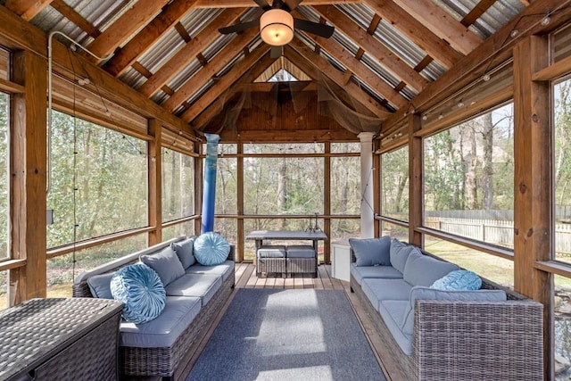 unfurnished sunroom featuring vaulted ceiling and ceiling fan