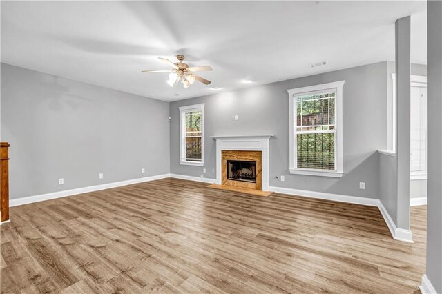 1714 Boulder Walk Ln SE, Atlanta, GA 30316 - unfurnished living room featuring a ceiling fan, plenty of natural light, and baseboards