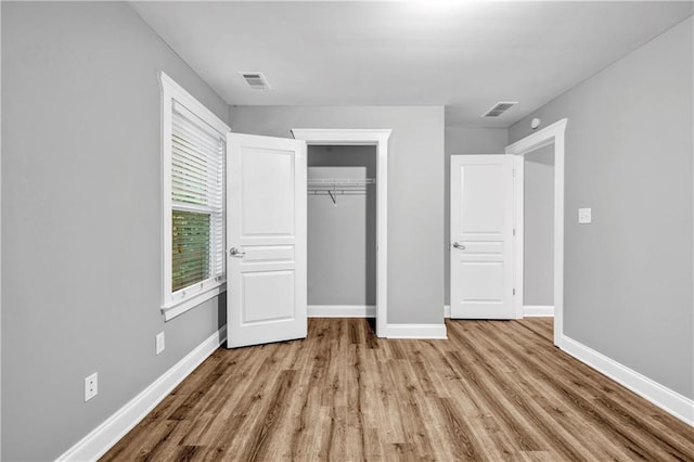 1714 Boulder Walk Ln SE, Atlanta, GA 30316 - unfurnished bedroom with wood finished floors, baseboards, and a closet