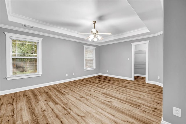 1714 Boulder Walk Ln SE, Atlanta, GA 30316 - spare room with a raised ceiling, ornamental molding, wood finished floors, baseboards, and a ceiling fan
