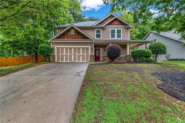 1714 Boulder Walk Ln SE, Atlanta, GA 30316 - craftsman house with fence, concrete driveway, a garage, a porch, and stone siding