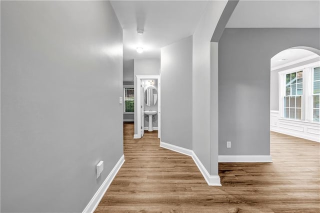 1714 Boulder Walk Ln SE, Atlanta, GA 30316 - corridor featuring arched walkways, wood finished floors, and baseboards