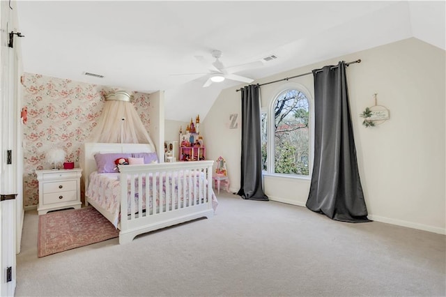 carpeted bedroom with baseboards, lofted ceiling, visible vents, and ceiling fan