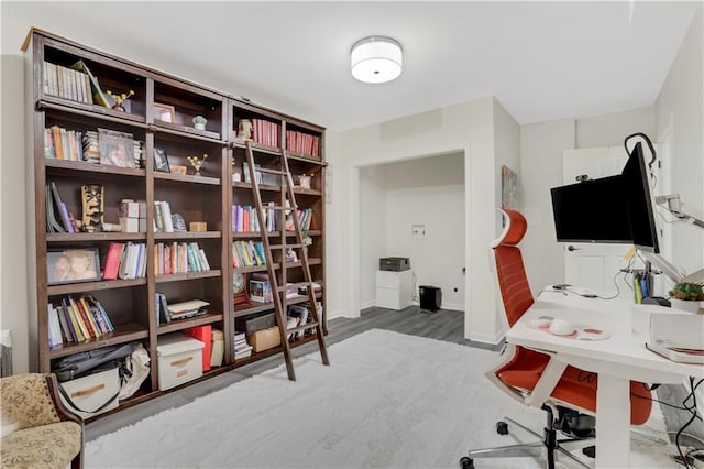 office area featuring baseboards and wood finished floors