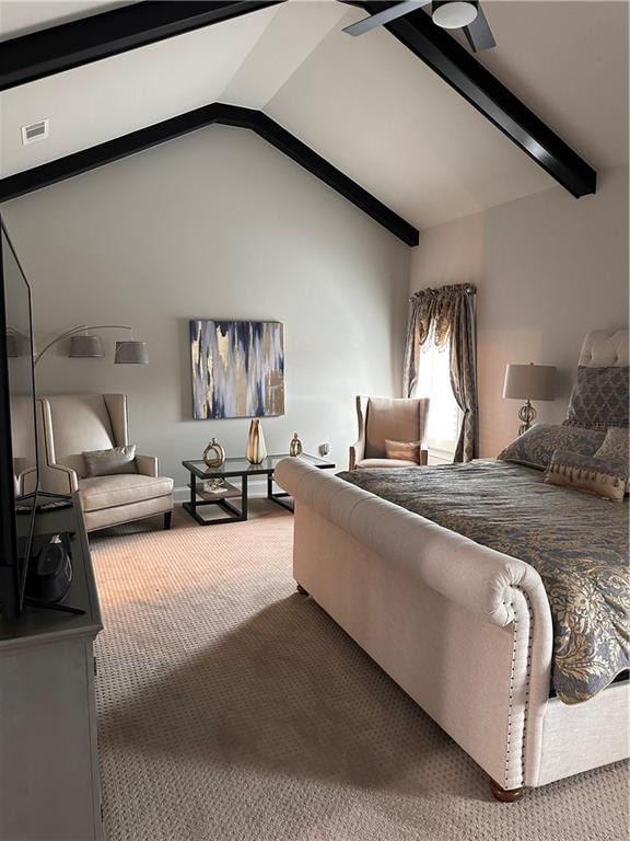 carpeted bedroom featuring ceiling fan and lofted ceiling with beams