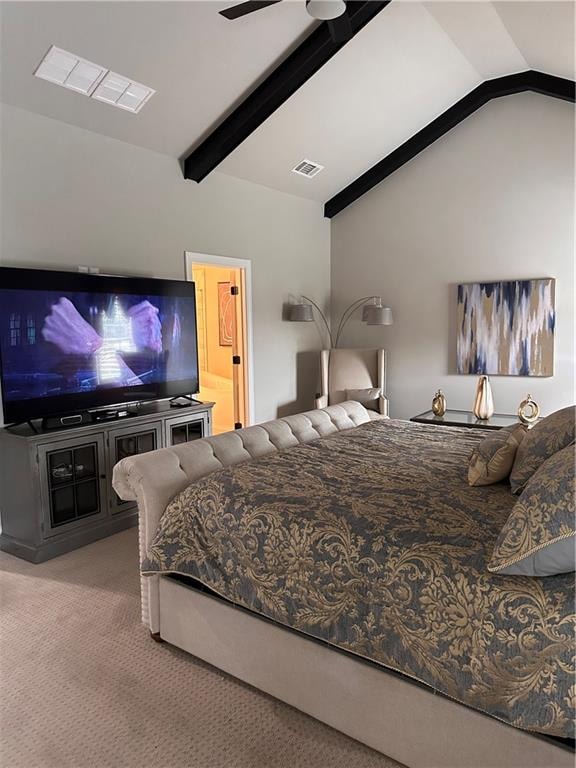 bedroom with ensuite bath, ceiling fan, carpet, and lofted ceiling with beams