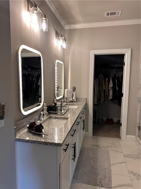 bathroom featuring vanity and ornamental molding