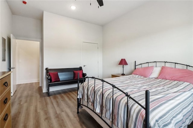 bedroom featuring recessed lighting, ceiling fan, and wood finished floors