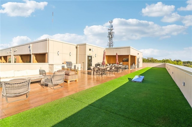 rear view of property with a lawn, a patio area, and an outdoor living space