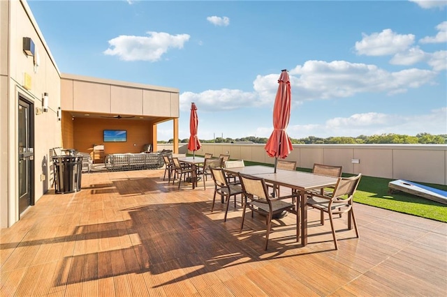 view of patio featuring outdoor dining area and fence