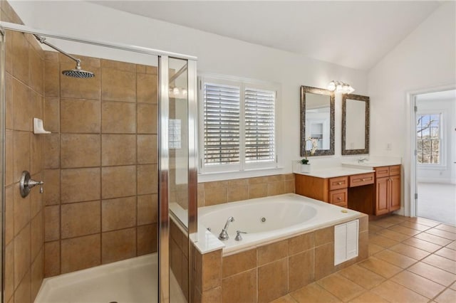 bathroom with lofted ceiling, vanity, tile patterned floors, and independent shower and bath