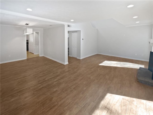 unfurnished living room featuring recessed lighting, wood finished floors, visible vents, and baseboards