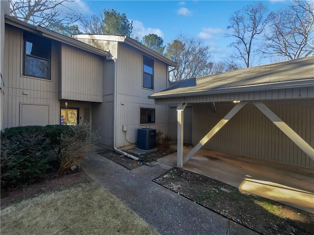 rear view of property with central air condition unit