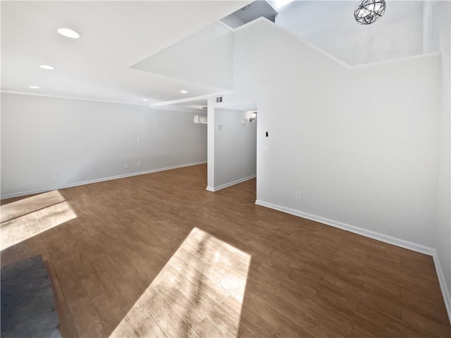 unfurnished living room with baseboards, wood finished floors, and recessed lighting