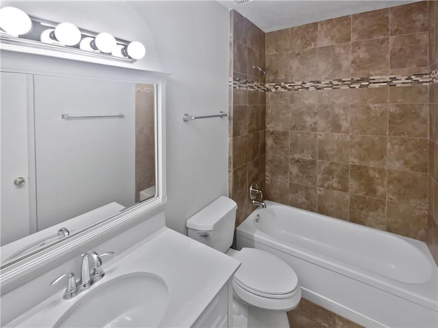 bathroom with shower / bathing tub combination, vanity, and toilet